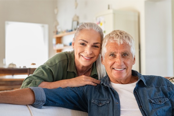 Mature adult couple smiling at camera